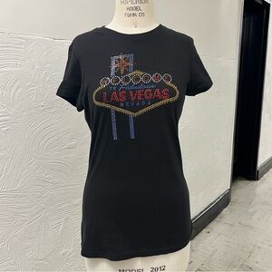 Las Vegas rhinestone t shirt, fits a Medium at best.
